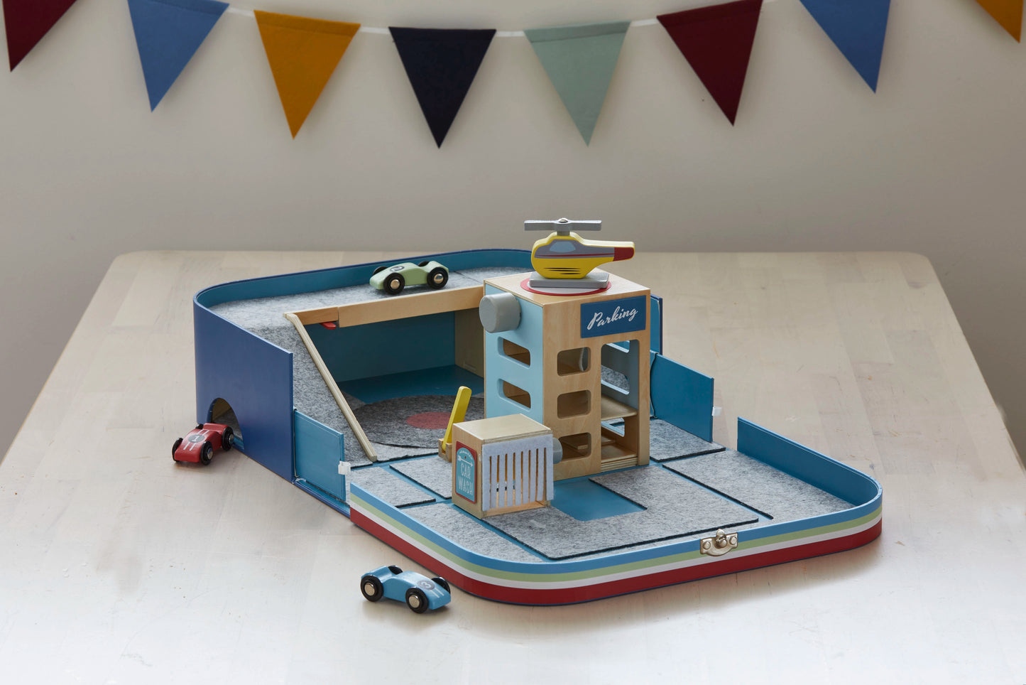 Car Lover Suitcase (suitable for children 3+ years) includes parking garage, car wash, 3 cars, 1 helicopter. Made of sustainable materials (FSC Timber, recycled felt), ethically produced, travel friendly, supports the development (fine motor skills, ..).